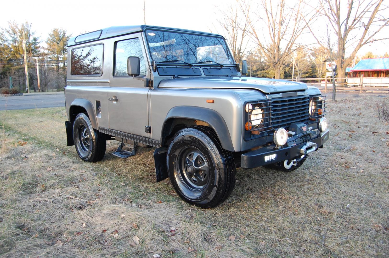 1990 Gray /Black Land Rover Defender (SALLDVAB8FA) with an Diesel engine, 5 speed manual transmission, located at 6528 Lower York Road, New Hope, PA, 18938, (215) 862-9555, 40.358707, -74.977882 - Here is a great running, great looking turn key 1990 Land Rover Defender.....Diesel engine, 5 speed manual transmission, roll up windows, black leather seats, steel wheels, 7.50R60 Silca Come 4x4 tires, fog lights, trailer hitch, Warn Zion 10-S power wynch. The engine has been rebuilt, body and i - Photo#0